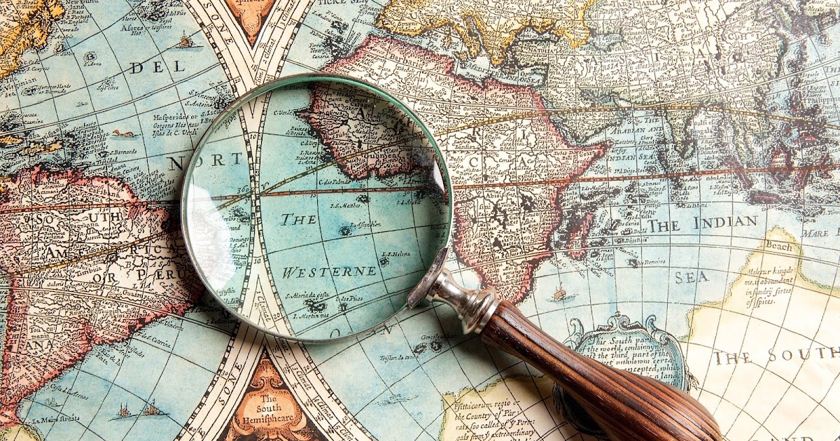 Magnifying-glass-and-ancient-old-map